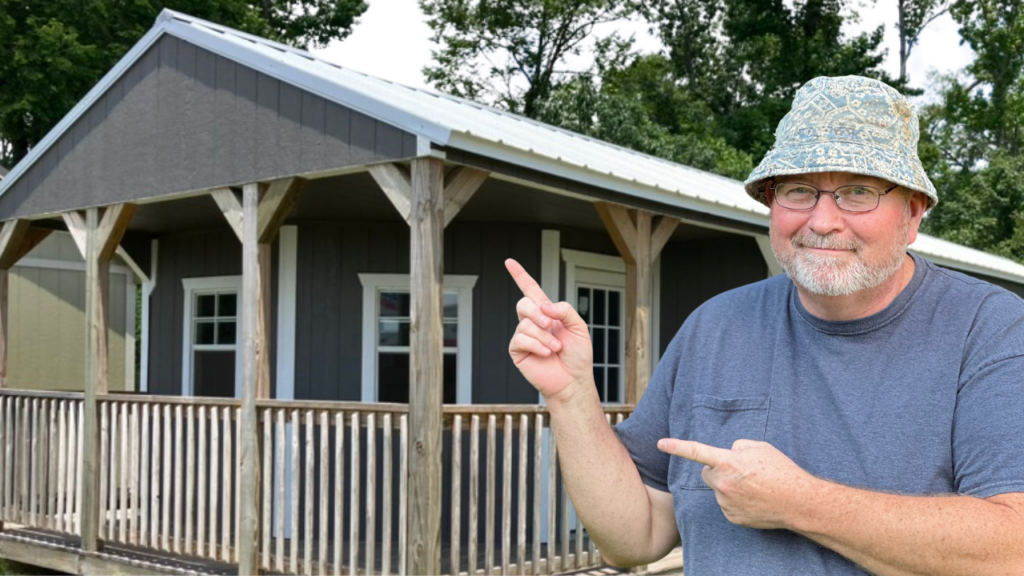 Tiny home with PawPaw in foreground pointing at tiny house.
